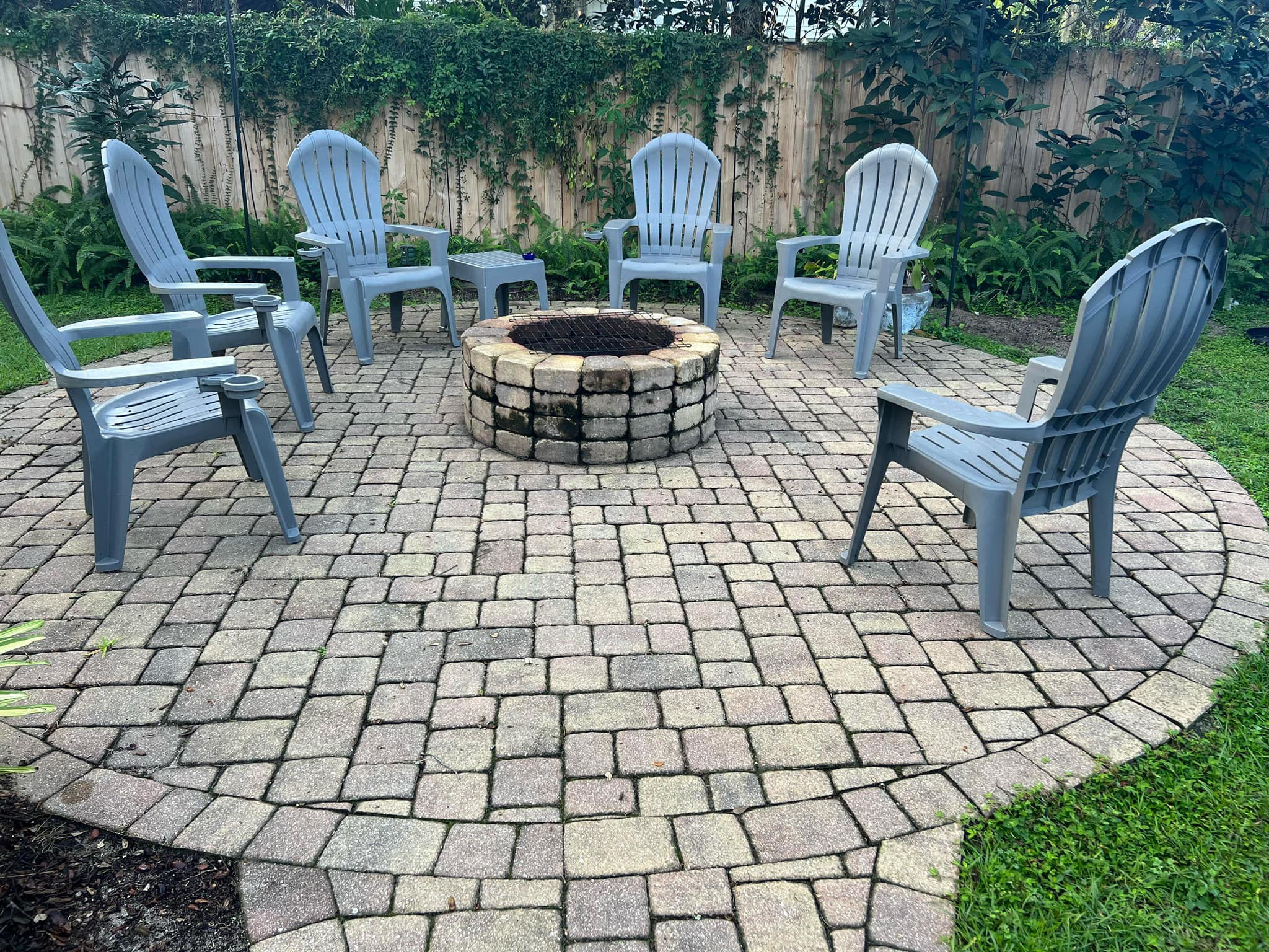 Fire pit patio before — dirty pavers, soot, grime